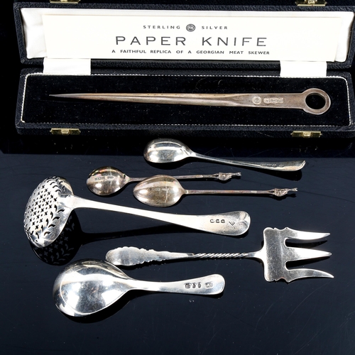 557 - Various silver, including Georgian meat skewer pattern paper knife, George III caddy spoon, bread fo... 