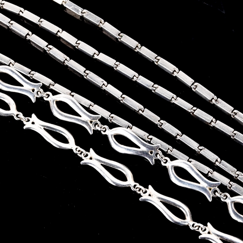 565 - An unmarked white metal block link necklace in the style of Wiven Nielsen, and a Danish sterling fis... 