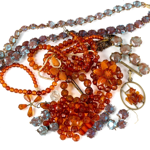 572 - Various amber beads, and a blue paste Riviere necklace, cross pendant and brooch set