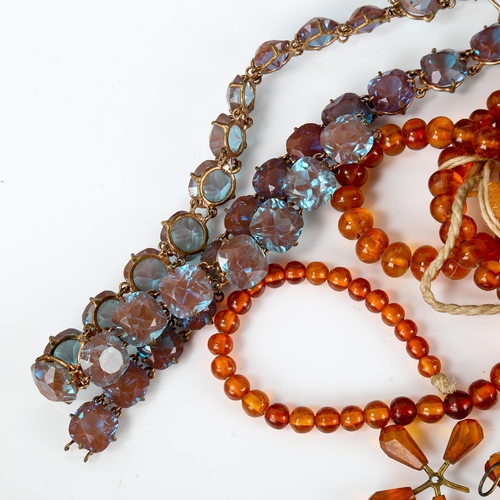 572 - Various amber beads, and a blue paste Riviere necklace, cross pendant and brooch set