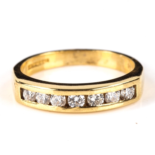 587 - A modern 18ct gold diamond half eternity ring, set with modern round brilliant-cut diamonds, total d... 