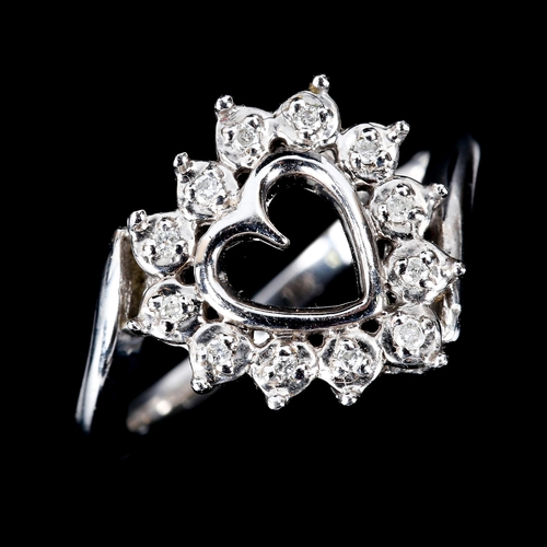 588 - A modern 9ct white gold diamond heart dress ring, set with modern round brilliant-cut diamonds, tota... 