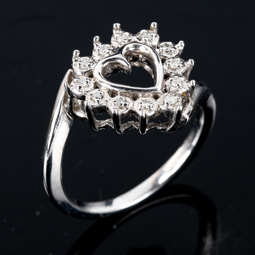 588 - A modern 9ct white gold diamond heart dress ring, set with modern round brilliant-cut diamonds, tota... 