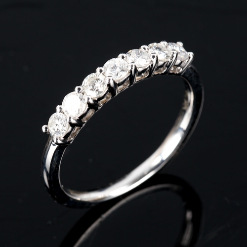 589 - A modern 9ct white gold 7-stone diamond ring, set with modern round brilliant-cut diamonds, total di... 