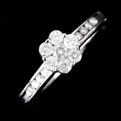 590 - A modern 18ct white gold diamond cluster ring, set with modern round brilliant-cut diamonds, total d... 