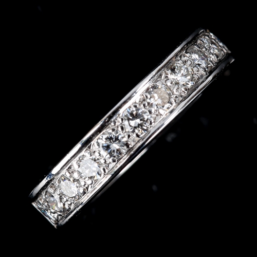 600 - An 18ct white gold diamond half eternity ring, set with modern round brilliant-cut diamonds, total d... 