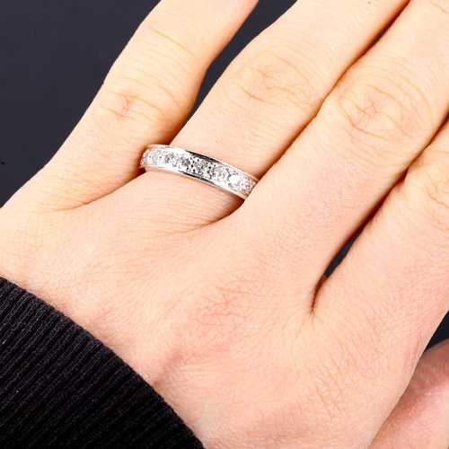 600 - An 18ct white gold diamond half eternity ring, set with modern round brilliant-cut diamonds, total d... 