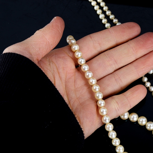 605 - 2 single-row cultured pearl necklaces, comprising example with 18ct clasp, and example with 9ct clas... 