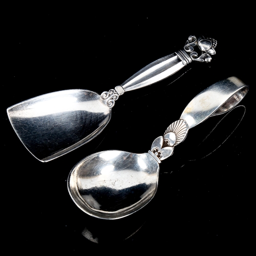 610 - GEORG JENSEN - a Danish sterling silver Kongens pattern tea caddy spoon, and a Cactus pattern baby s... 