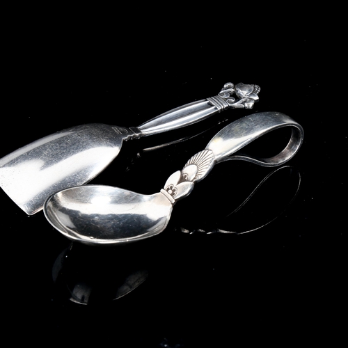 610 - GEORG JENSEN - a Danish sterling silver Kongens pattern tea caddy spoon, and a Cactus pattern baby s... 