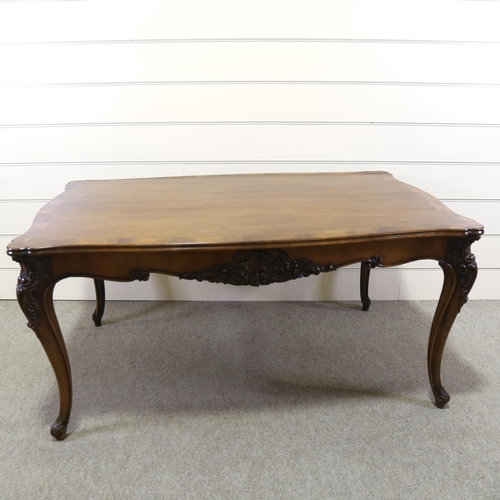 1150 - A 19th century figured walnut library table, with shaped moulded top, 2 carved frieze drawers and ca... 