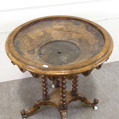 1151 - A 19th century circular walnut table base, with shaped frieze, barley twist supports and carved base... 