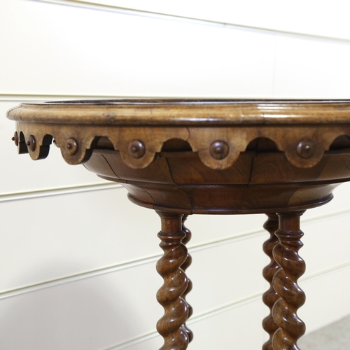 1151 - A 19th century circular walnut table base, with shaped frieze, barley twist supports and carved base... 