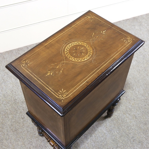 1155 - A Victorian walnut and boxwood inlaid Canterbury box, with hinged lid and turned legs, width 48cm, h... 