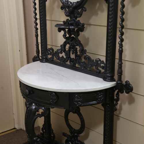 1207 - Coalbrookdale cast-iron hall stand, with relief cast decoration, original hooks, inset oval mirror a... 