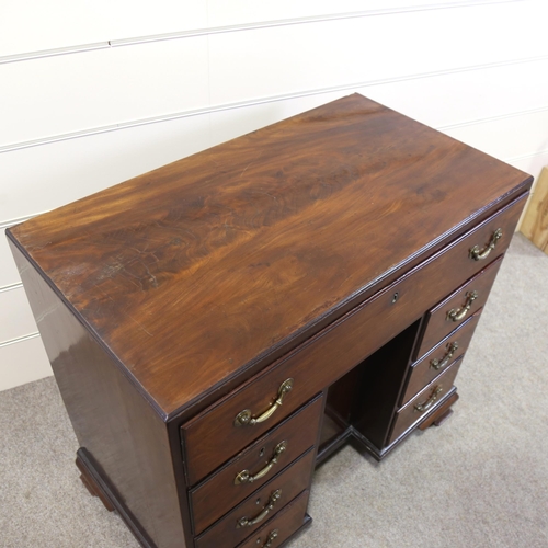 1209 - A Georgian mahogany kneehole desk with alcove cupboard, 92cm x 50cm