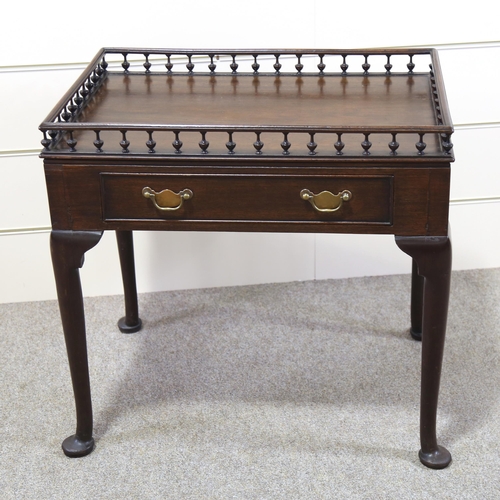 1211 - A Georgian mahogany silver table, with spindled gallery and frieze drawer, 70cm x 47cm