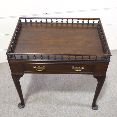 1211 - A Georgian mahogany silver table, with spindled gallery and frieze drawer, 70cm x 47cm