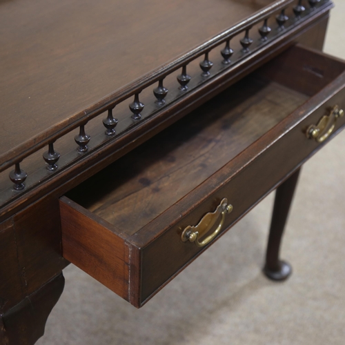 1211 - A Georgian mahogany silver table, with spindled gallery and frieze drawer, 70cm x 47cm