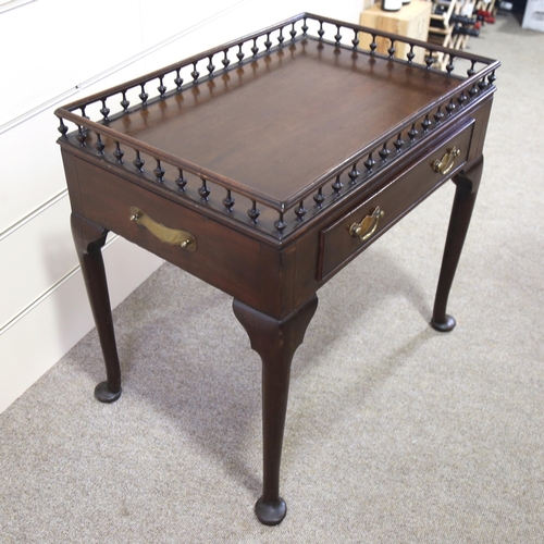 1211 - A Georgian mahogany silver table, with spindled gallery and frieze drawer, 70cm x 47cm