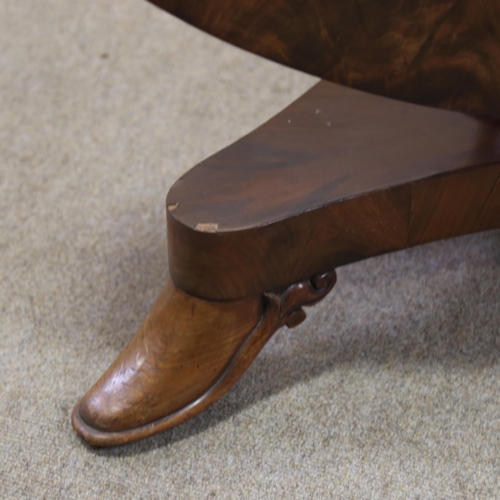 1216 - A 19th century Manx circular mahogany tilt-top dining table on stylised platform base, diameter 125c... 