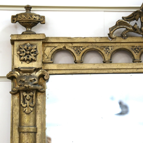 1219 - A 19th century gilt-framed wall mirror, with Classical mask pediment, height excluding pediment 150c... 