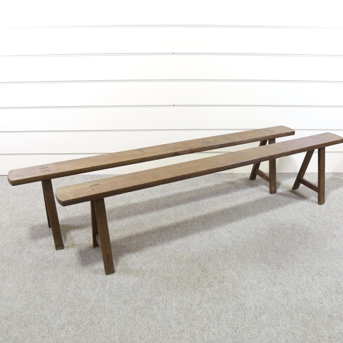 1220 - A pair of 19th century oak trestle benches, length 203cm