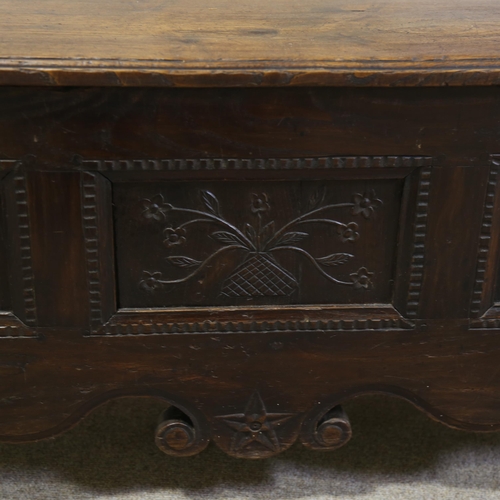 1255 - A 19th century French oak settle, with carved panelled back and rising seat, width 114cm