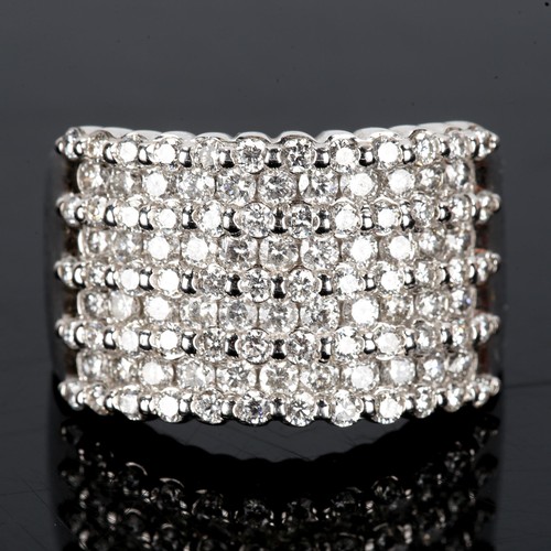 378 - A large and heavy modern 14ct white gold diamond cluster band ring, set with graduated rows of moder... 