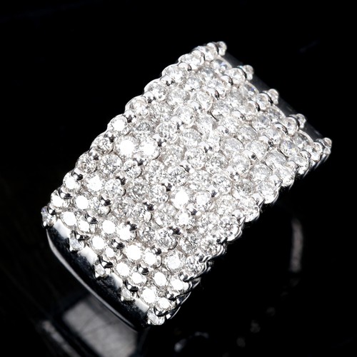 378 - A large and heavy modern 14ct white gold diamond cluster band ring, set with graduated rows of moder... 