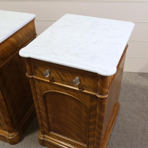 1266 - A pair of 19th century satinwood pedestal cupboards, with shaped white marble tops, single frieze dr... 