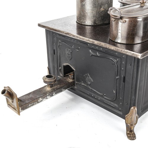 1261 - A Marklin tinplate stove and accessories, width 37cm