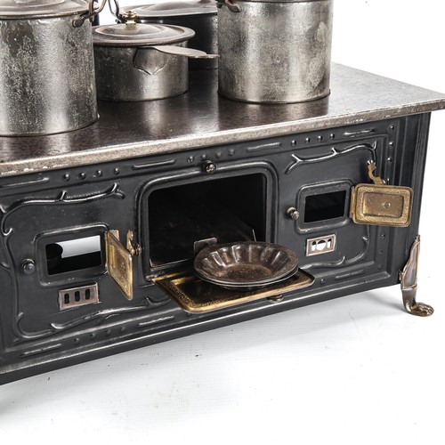 1261 - A Marklin tinplate stove and accessories, width 37cm