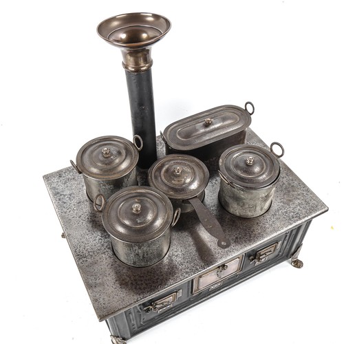 1261 - A Marklin tinplate stove and accessories, width 37cm