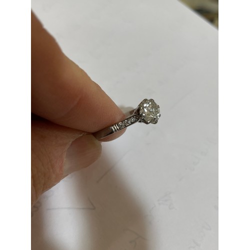 124 - An Antique platinum 0.6ct solitaire diamond ring, claw set with round brilliant diamond and single-c... 