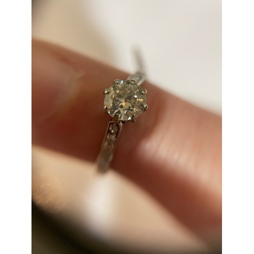 124 - An Antique platinum 0.6ct solitaire diamond ring, claw set with round brilliant diamond and single-c... 