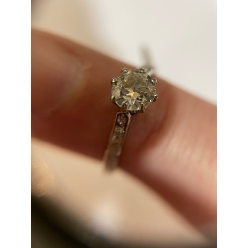 124 - An Antique platinum 0.6ct solitaire diamond ring, claw set with round brilliant diamond and single-c... 