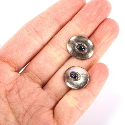 153 - A modern pair of sterling silver cabochon sapphire cufflinks, maker's marks PGK, hallmarks London 20... 