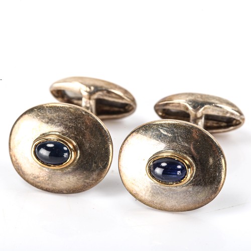 153 - A modern pair of sterling silver cabochon sapphire cufflinks, maker's marks PGK, hallmarks London 20... 