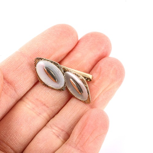 160 - A pair of French 14ct gold mother-of-pearl lozenge cufflinks, panel length 17.7mm, 7g