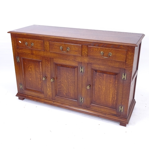 2134 - A modern stained oak sideboard, with 3 frieze drawers, W137cm, H84cm, D48cm