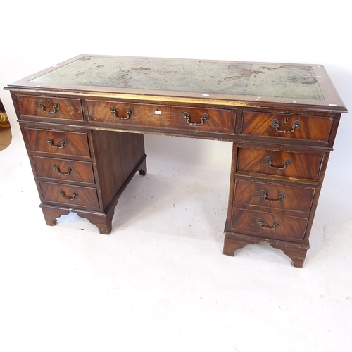 2065 - A reproduction mahogany twin-pedestal writing desk, W138cm, H78cm, D69cm