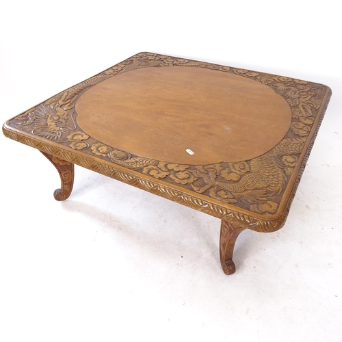 2068 - A low square coffee table with relief carved dragon decoration, W83cm, H32cm