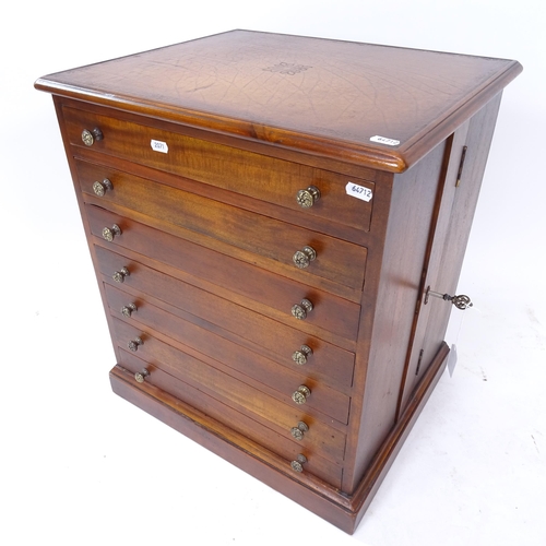 2071 - A good quality hardwood reproduction collector's chest, with a fitted leather skiver and 7 short dra... 