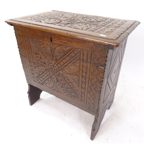 2072 - An Antique oak coffer of small size, with chipped carved decoration, W62cm, H62cm, D40cm