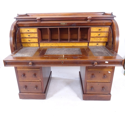 2096 - A 19th century mahogany cylinder-front twin-pedestal writing desk, with a fitted and sliding interio... 