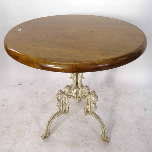 2136 - A circular pub table on cast-iron tripod legs, W60cm, H70cm