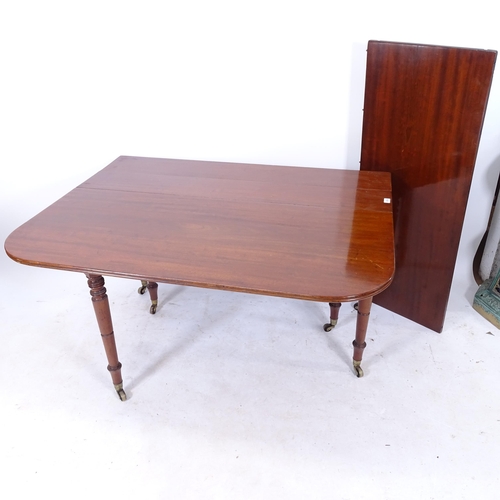 2149 - A Georgian mahogany drop leaf extending dining table, with reeded edge, raised on 6 ring turned legs... 