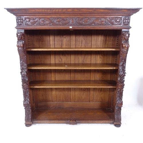 2156 - A Victorian oak open bookcase, with adjustable shelves and relief and applied carved decoration, W12... 