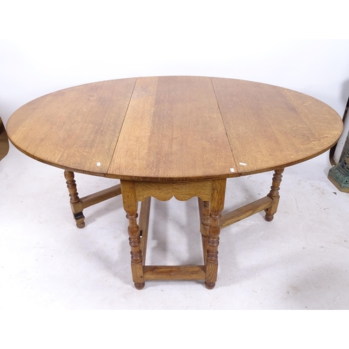 2159 - A large golden oak gateleg table, with baluster turned legs, W123cm, H75cm